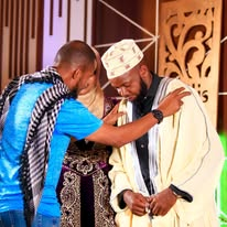 A guest being honoured on stage at a Swafi Films production